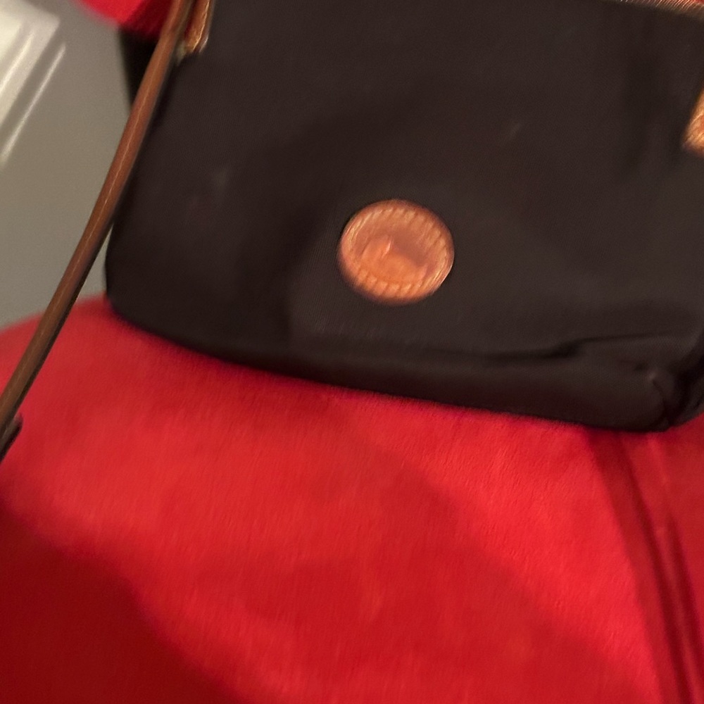Pre loved Dooney and Bourke crossbody nylon bag. Please check photos